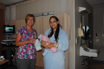 Jennifer Garza and her new baby Girl with Lactation Consultant Tina Bernsen. Garza was the first swaddle blanket recipient.