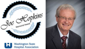 Two images next to each other; The left image is the logo for the Joe Hopkins Memorial Award, with the award name surounded by a blue and black gear and light blue grape leaves. Below it is the blue logo for the Washington State Hospital Association. The right image is a headshot of Dr. Peter Rutherford in a gray suit with a red patterned tie, in front of a gray background.