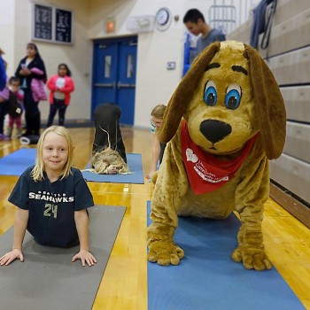 Max the dog does yoga with local kids